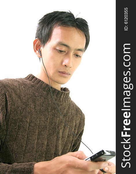 Man and cellular phone with headphone