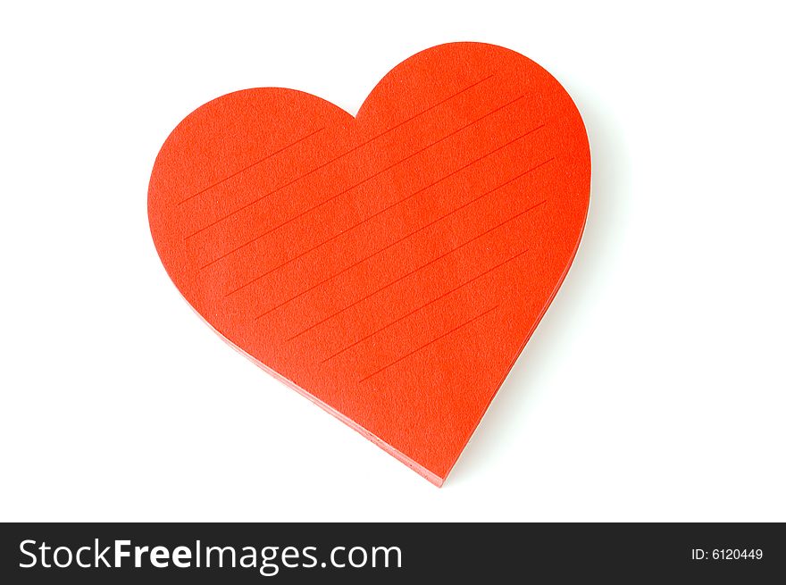 Love note in heart shaped pad over a white background. Love note in heart shaped pad over a white background