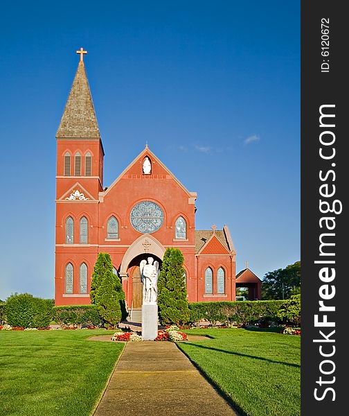 Red brick church and landscaped grounds. Red brick church and landscaped grounds
