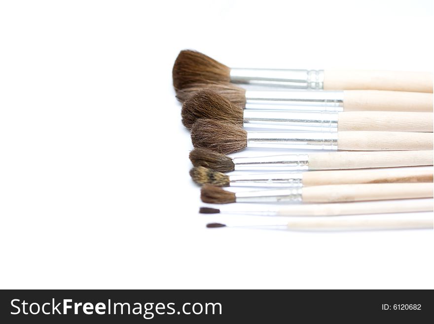 Different thickness proffesional brushes on white background