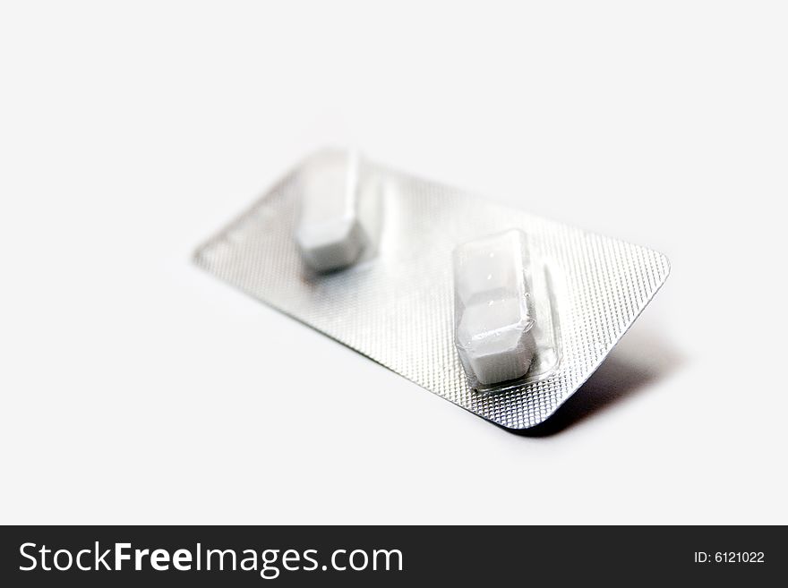 A pair of pills isolated over white