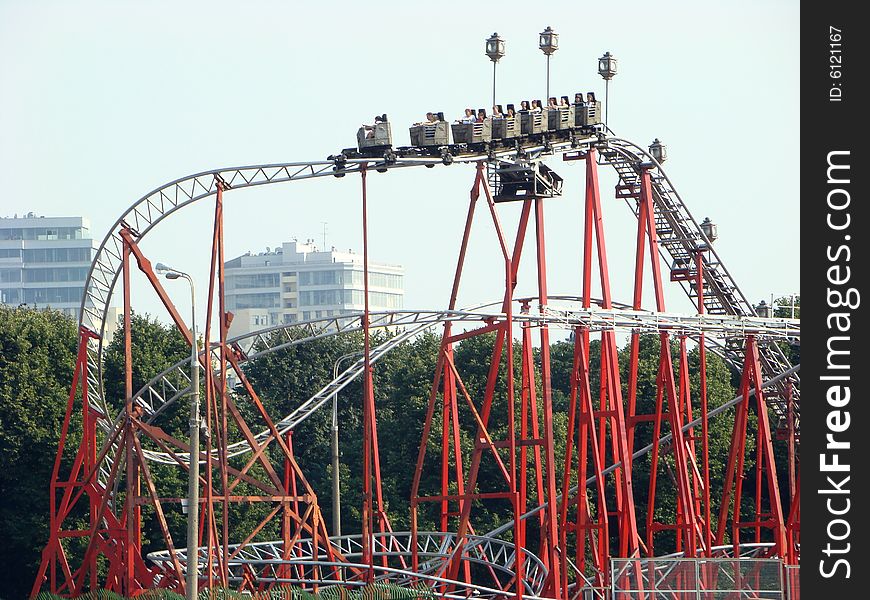 People go for a drive on an attraction the American hills in a recreation park