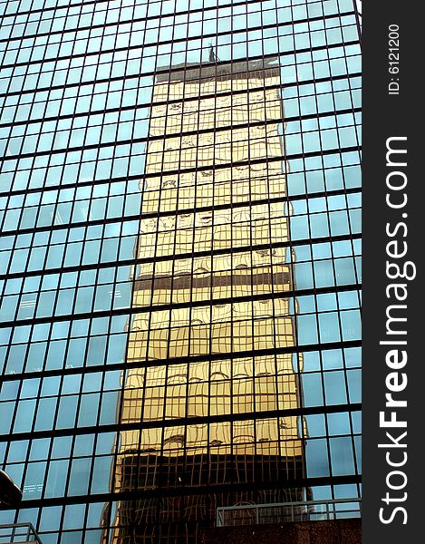 Hongkong Central - city center with modern skyscraper, one building reflected by another. Hongkong Central - city center with modern skyscraper, one building reflected by another.