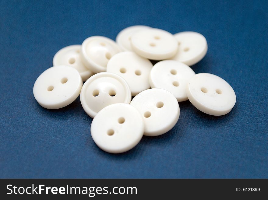 Isolated white buttons on blue background