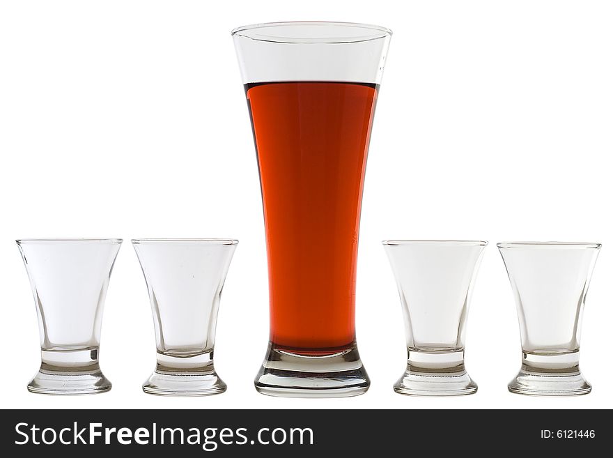 Four empty shots and one full beer glass. Four empty shots and one full beer glass