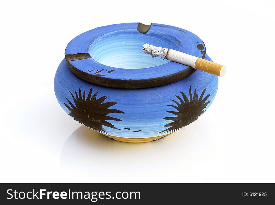 Blue ashtray on the white background