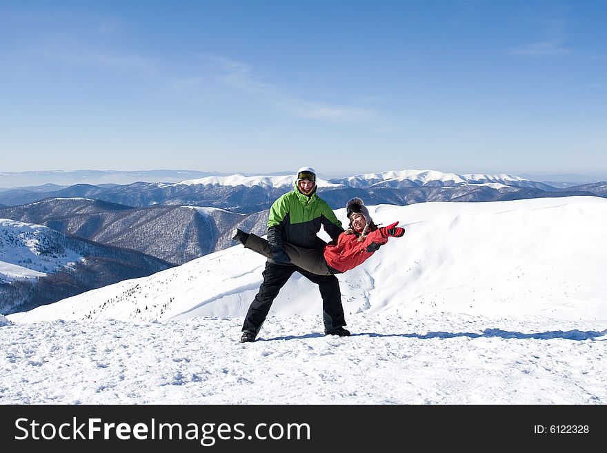 The snowboarder on a background of the blue sky