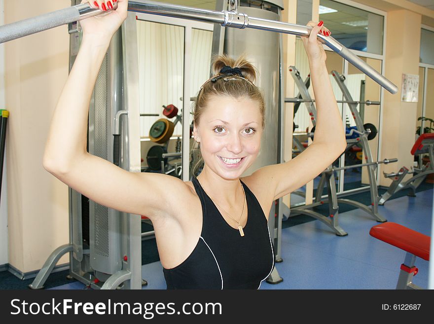 Young, beautiful woman in sport hall. Young, beautiful woman in sport hall