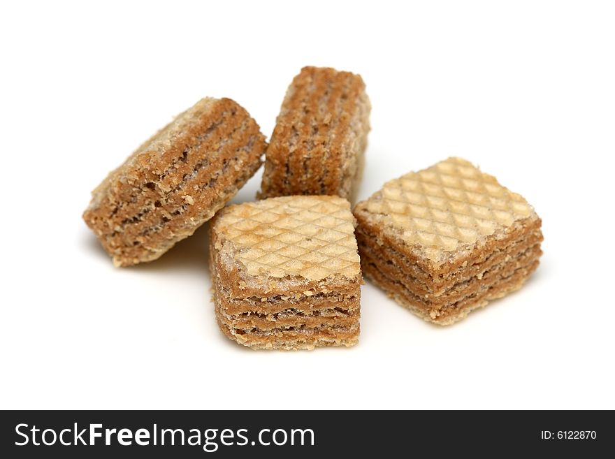 Cappuccino cream filled wafer cubes isolated on white background.