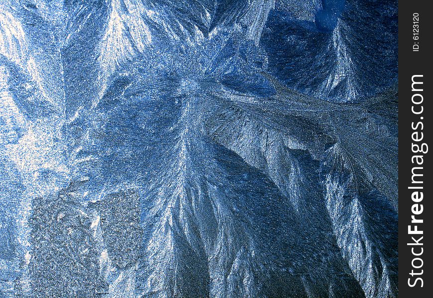 Icy pattern on window, frosty winter