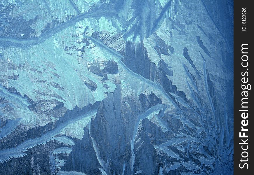 Icy pattern on window, frosty winter