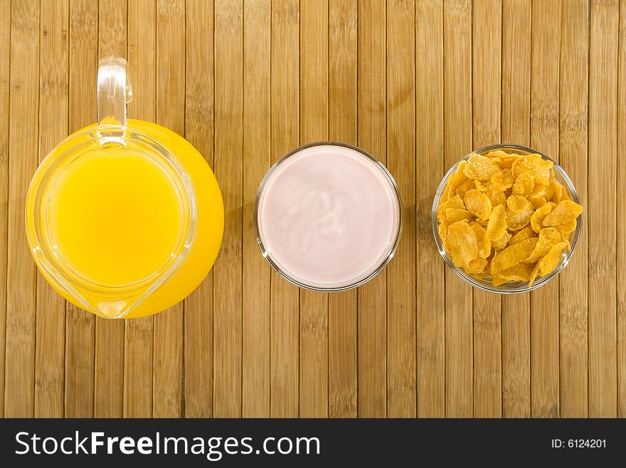 Corn flakes,yoghurt and orange juice. Corn flakes,yoghurt and orange juice