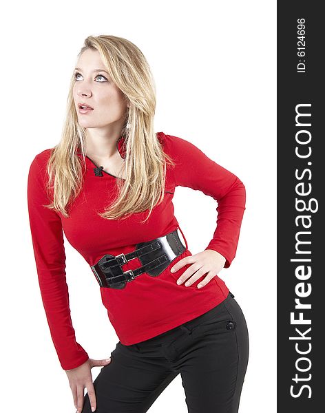 Beautiful blonde woman wearing a red top and black pants. Isolated on white background