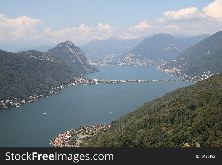View of Lugano Lake with bridge of melide