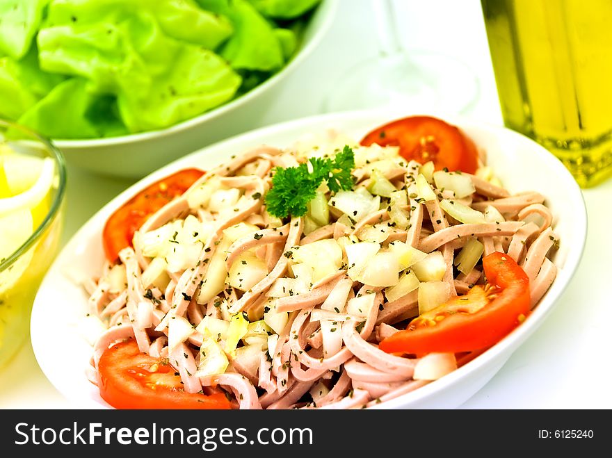 Gourmet meat salad with tomato,onion,lettuce.