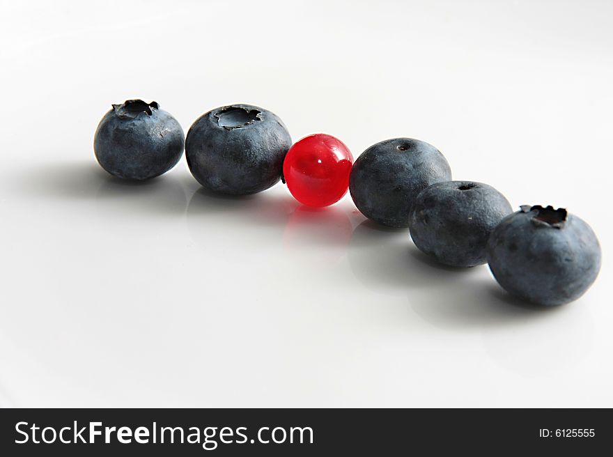 Black currant and red currant on a grey background. Black currant and red currant on a grey background