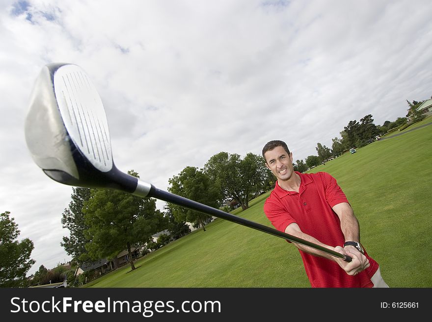 Man holding golf club. Horizontally framed photo. Man holding golf club. Horizontally framed photo.