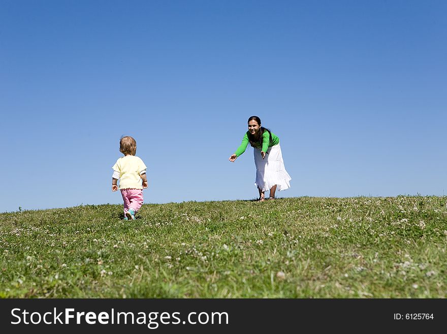 Active family on green meadow. Active family on green meadow