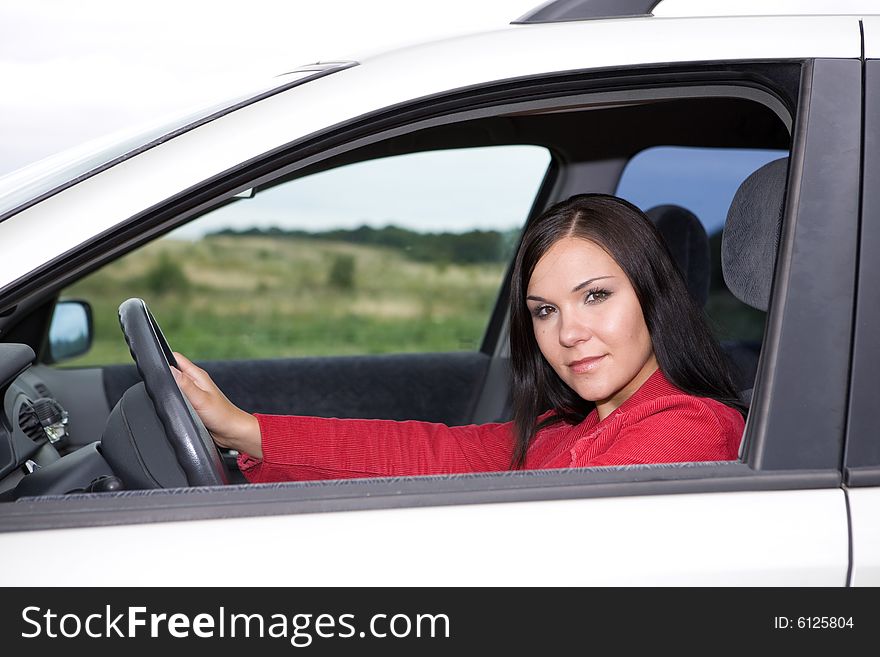Casual woman traveling by car. Casual woman traveling by car