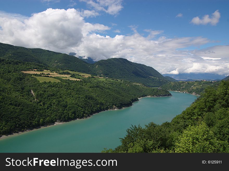 Panoramic view on long mountain lake in France, Isere , horizontal