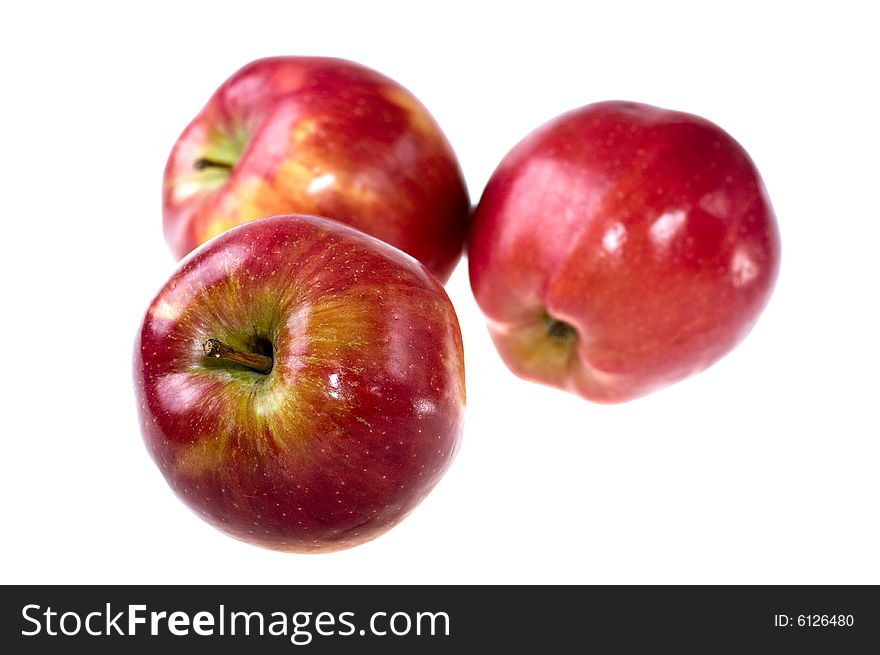 Three apples on a white background