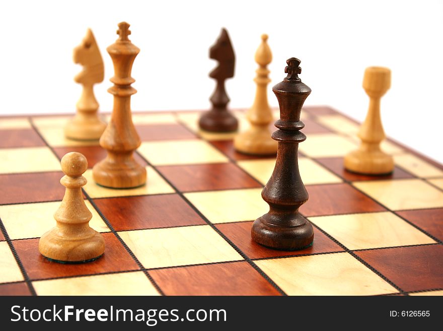 Wooden chess on wooden chessboard in studio