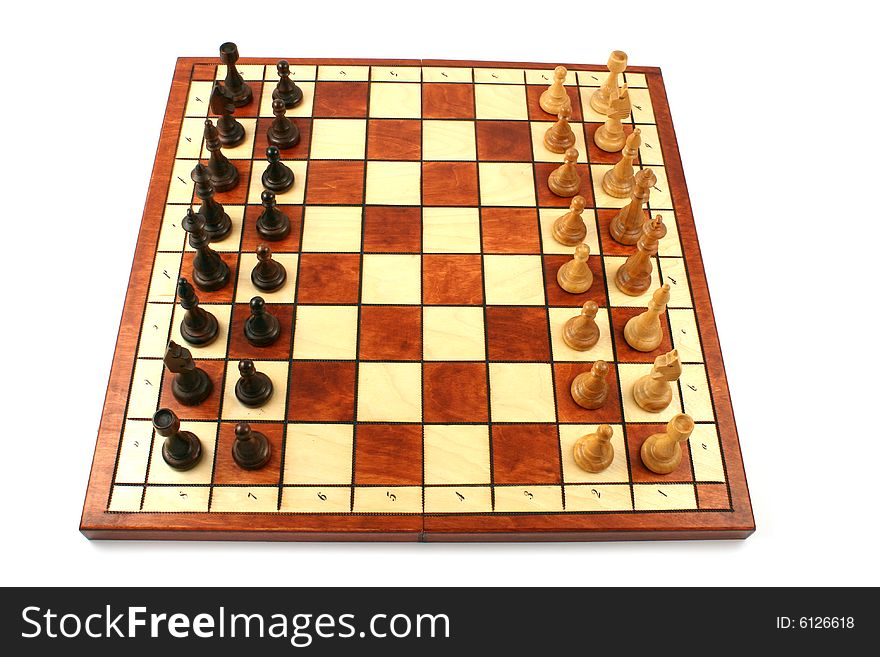 Wooden chess on wooden chessboard in studio