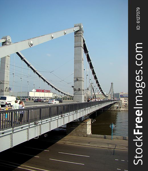 Bridge of Bogdan Khmelnitskiy or the Kiev bridge the steel arch foot bridge through Moscow - the river in Moscow