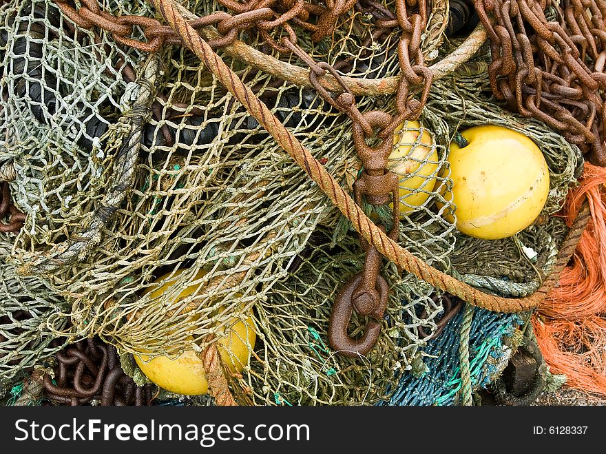 A pile of nets,floats and ropes discarded at a French fishing port. A pile of nets,floats and ropes discarded at a French fishing port