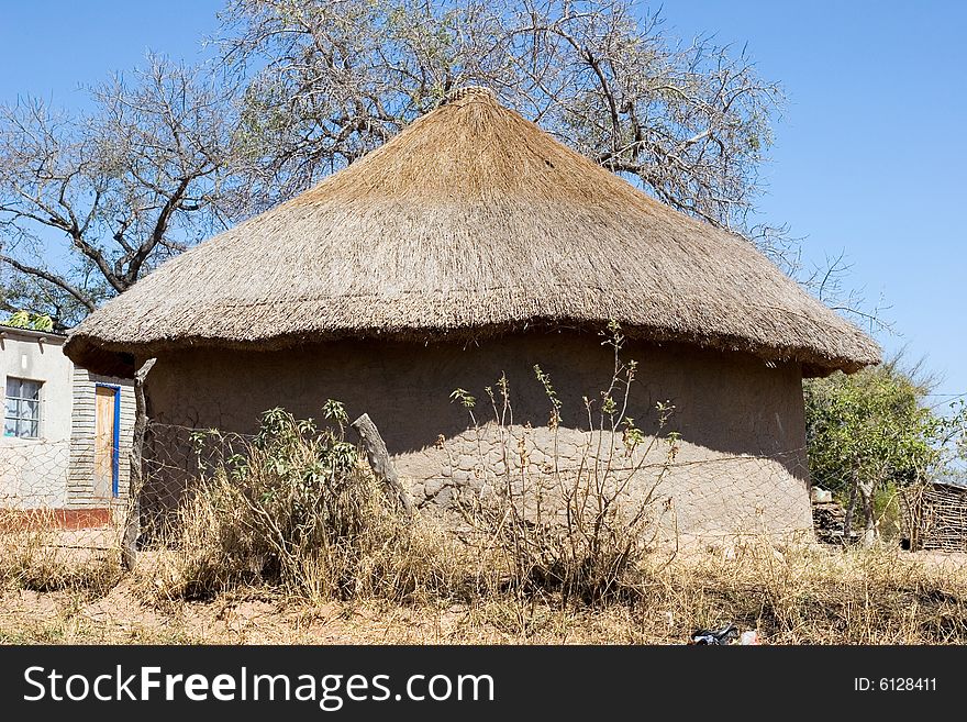 Just off the big cities of south africa there is landscape, hut in the old style of the african tribes. Just off the big cities of south africa there is landscape, hut in the old style of the african tribes