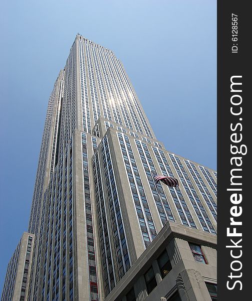 The skyscraper with sunlight reflections in Manhattan, New York City. The skyscraper with sunlight reflections in Manhattan, New York City.