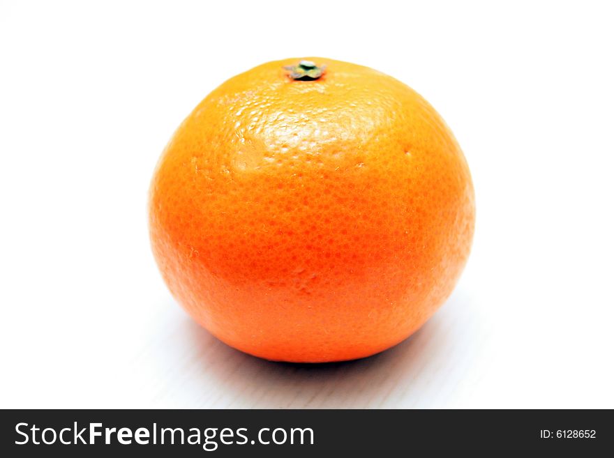 A bright orange tangerine ready to eat. A bright orange tangerine ready to eat