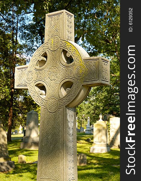 Celtic cross tombstone in cemetery