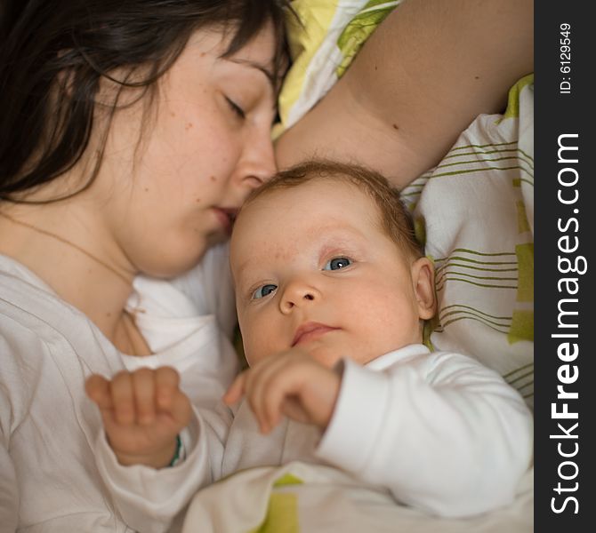 Baby with mom in the bed. Baby with mom in the bed