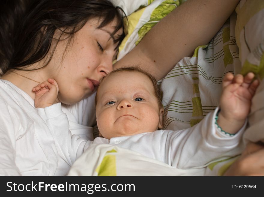 Baby with mom in the bed. Baby with mom in the bed