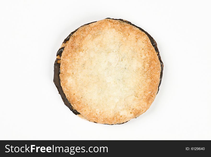 Crisp cookie sandwiched with dark chocolate - macro, isolated on white