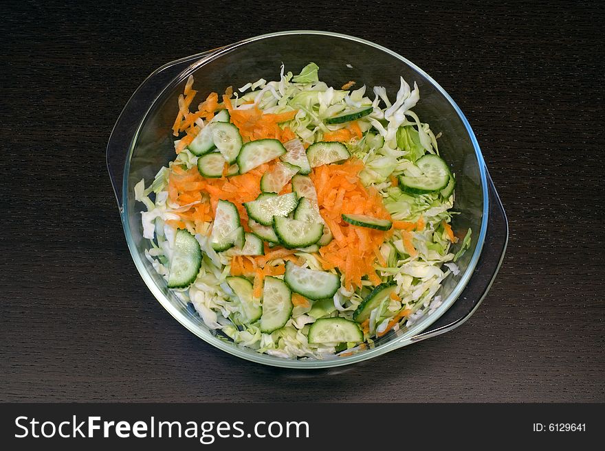 Vegetable fresh mix salad on brown table. Vegetable fresh mix salad on brown table