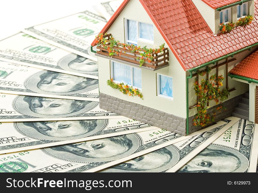 Miniature House and Money. Buying house concept