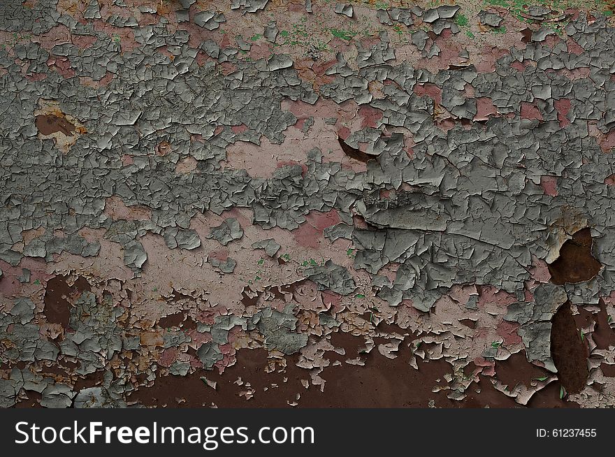 The texture of cracked paint on the rusty wall. The texture of cracked paint on the rusty wall.