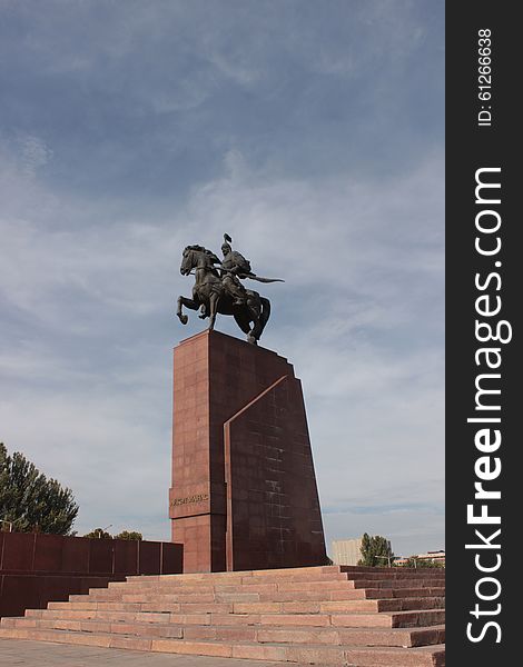 A statue depicting Manas, the legendary kyrgyz national hero. It's located in front of the history museum in Ala-too square, downtown Bishkek, capital of Kyrgyzstan. A warrior on horseback. The stories about Manas are part of the UNESCO world heritage. A statue depicting Manas, the legendary kyrgyz national hero. It's located in front of the history museum in Ala-too square, downtown Bishkek, capital of Kyrgyzstan. A warrior on horseback. The stories about Manas are part of the UNESCO world heritage.