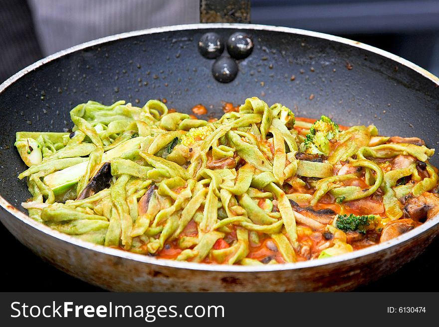 Green Italian pasta with broccoli in pan. Green Italian pasta with broccoli in pan