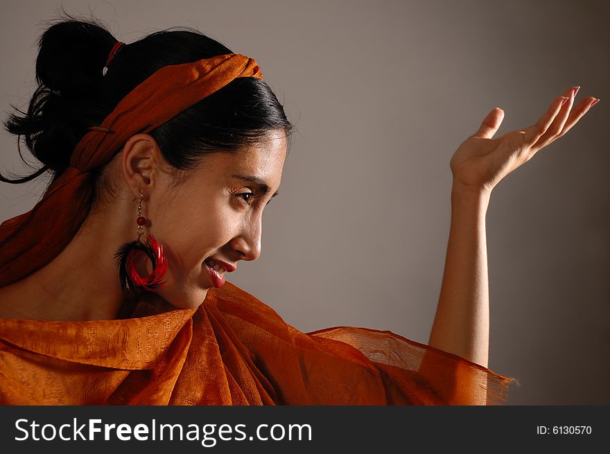 Portrait of hispanic dancer female with orange veil. Portrait of hispanic dancer female with orange veil