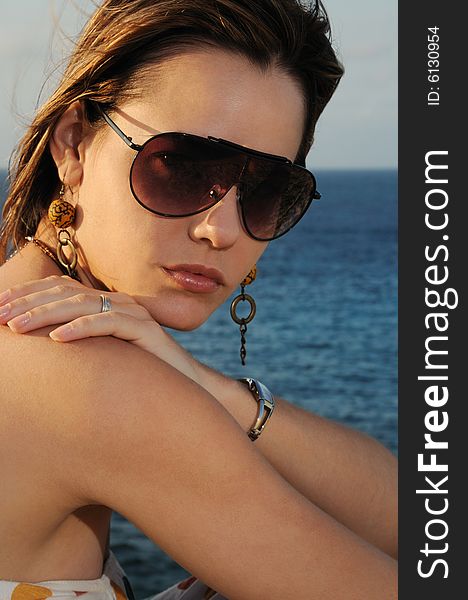 Portrait of young fashion female wearing sunglasses. Portrait of young fashion female wearing sunglasses