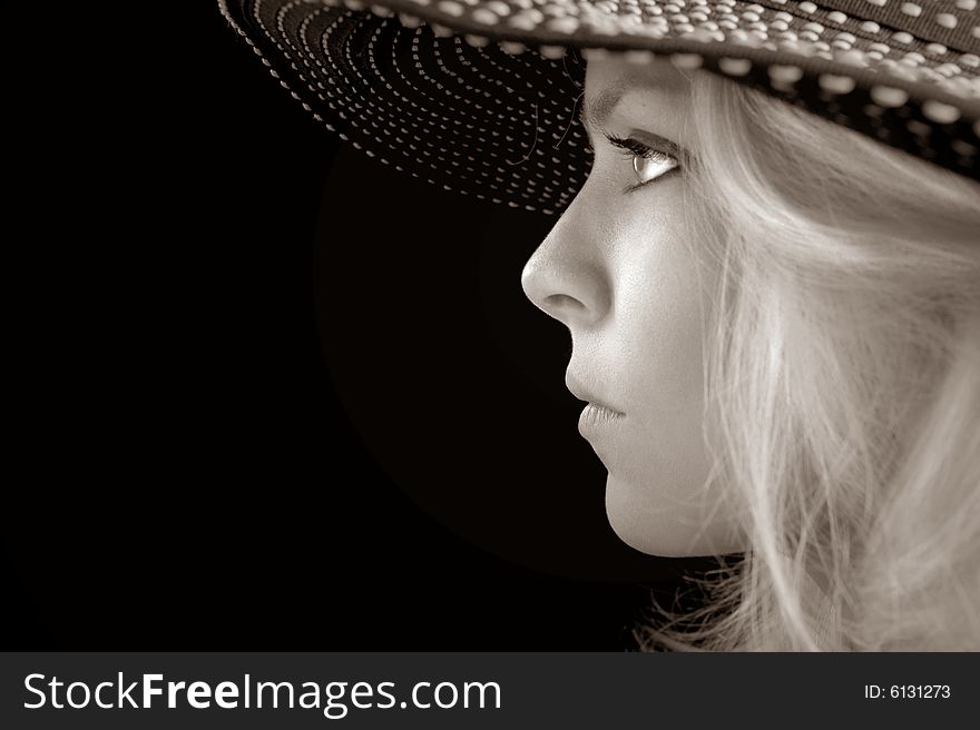 Beautiful Image of a woman in a hat On Black. Beautiful Image of a woman in a hat On Black