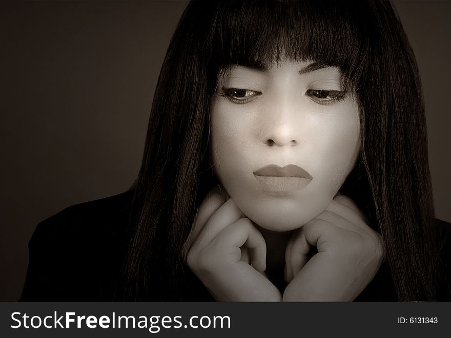 Beautiful Business woman in thought on grey