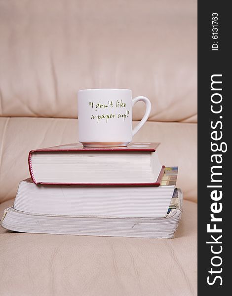 A cup of coffee on book