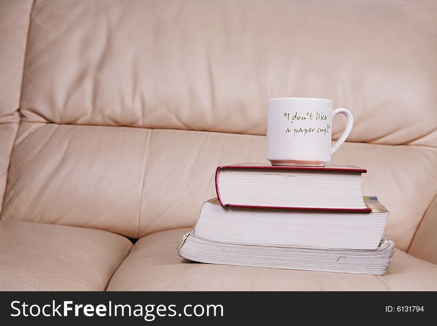 A cup of coffee on book