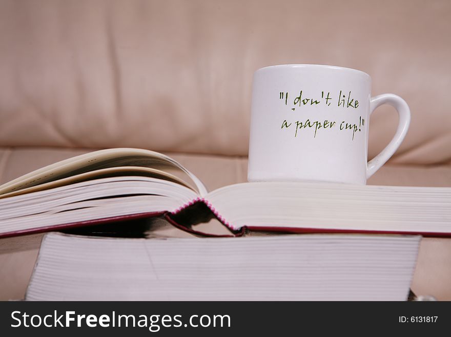 Cup of coffee on book