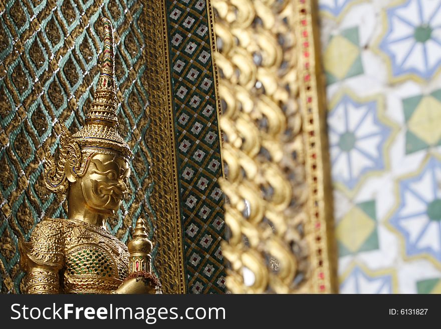 A gold guard in a palace at Bangkok, Thailand