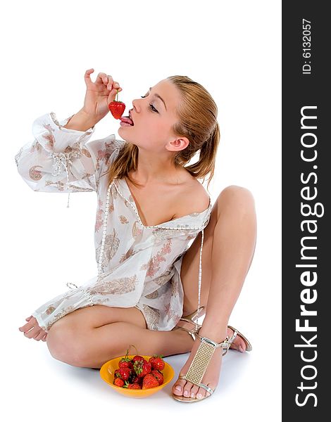 Beautiful girl with strawberry over white